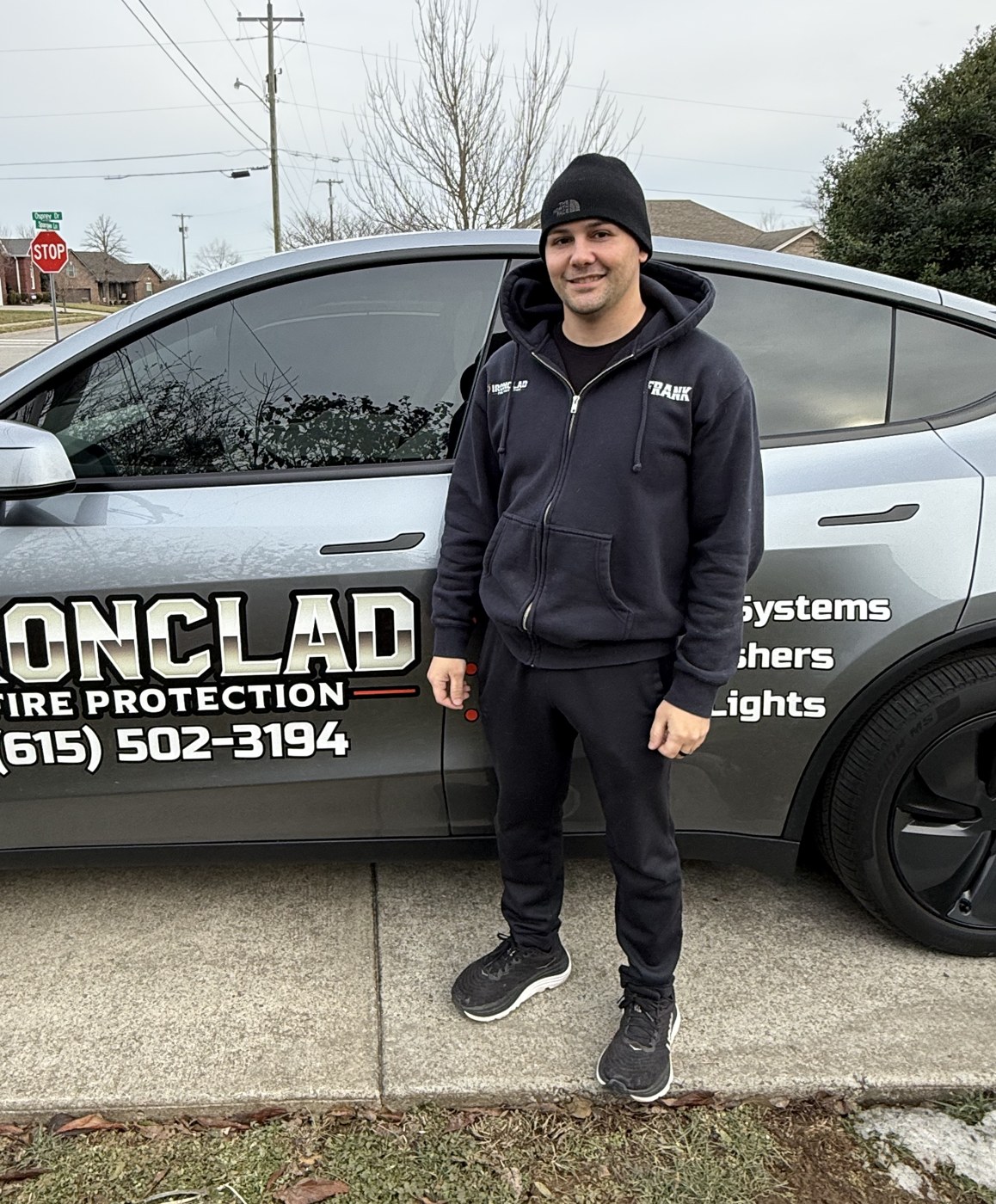 Frank Jones, owner of Ironclad Fire Protection, standing beside his service vehicle